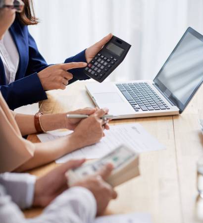 Calculating Mortgage Payment Real estate agent helping senior couple to calculate mortgage payment and down payment