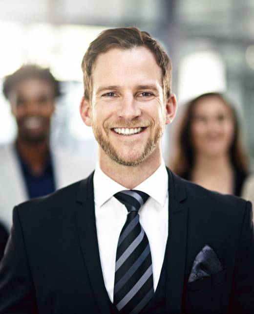 Cropped portrait of a group of businesspeople standing in the office. Cropped portrait of a group of businesspeople standing in the office.