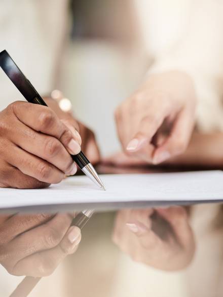 Do these terms meet your needs. Shot of a businesswoman signing a contract Do these terms meet your needs. Shot of a businesswoman signing a contract