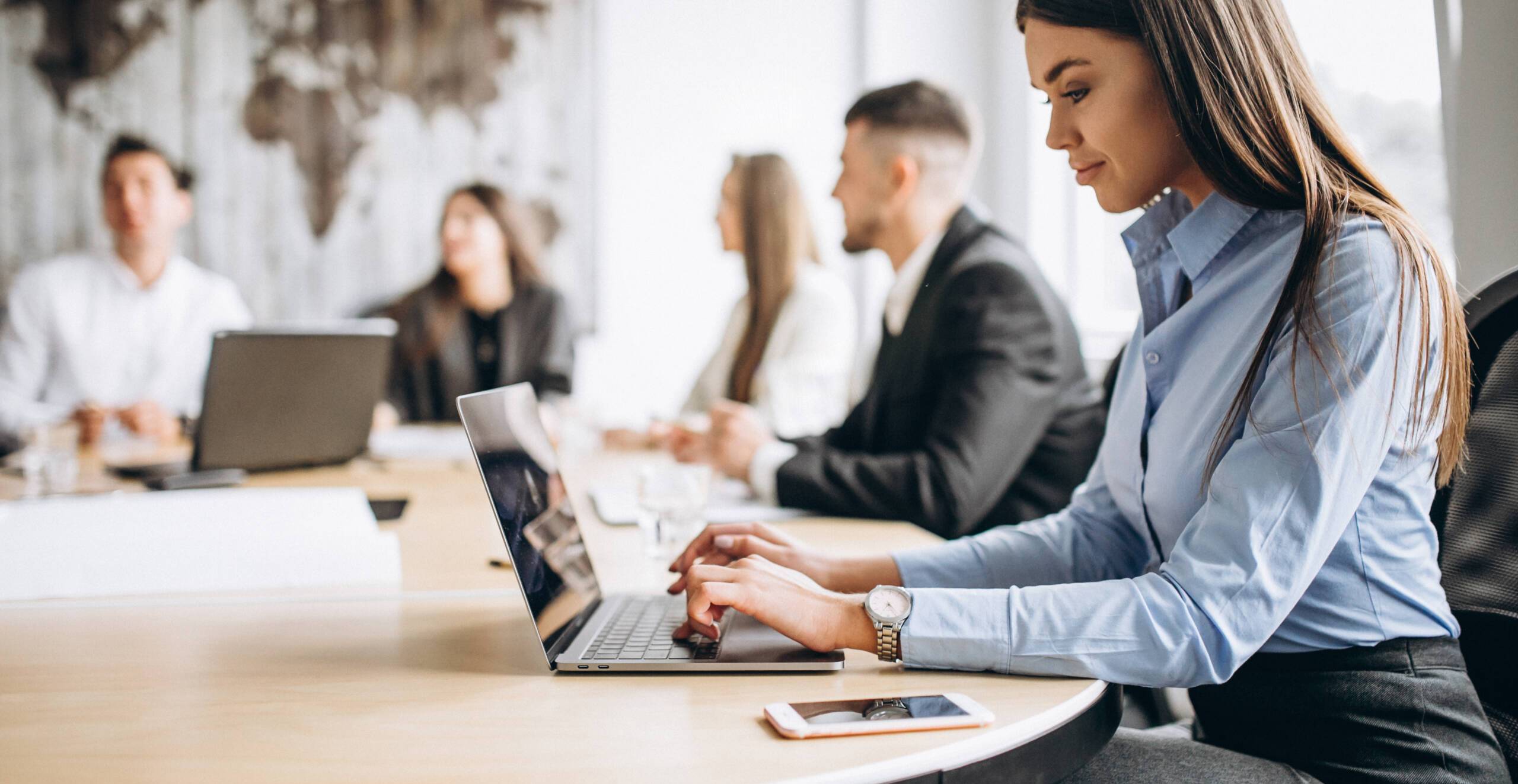 Group of people working out business plan in an office Group of people working out business plan in an office